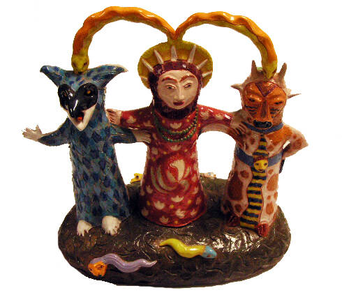Sculptural piece with three anthropomorphic figures. The two on either side appear to be wearing masks.
